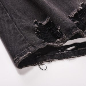 Image of a Custom Denim Jacket with washed hole whisker design